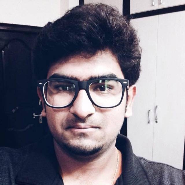 Portrait with thick black glasses indoors