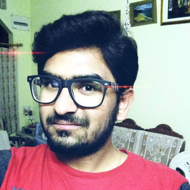 Selfie at home in a red tee