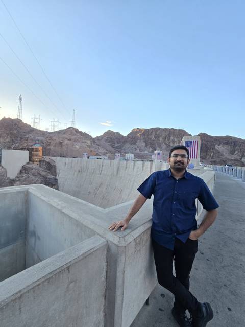 At a large concrete dam at dusk