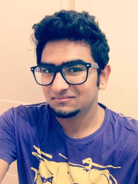 Smiling portrait in a purple tee