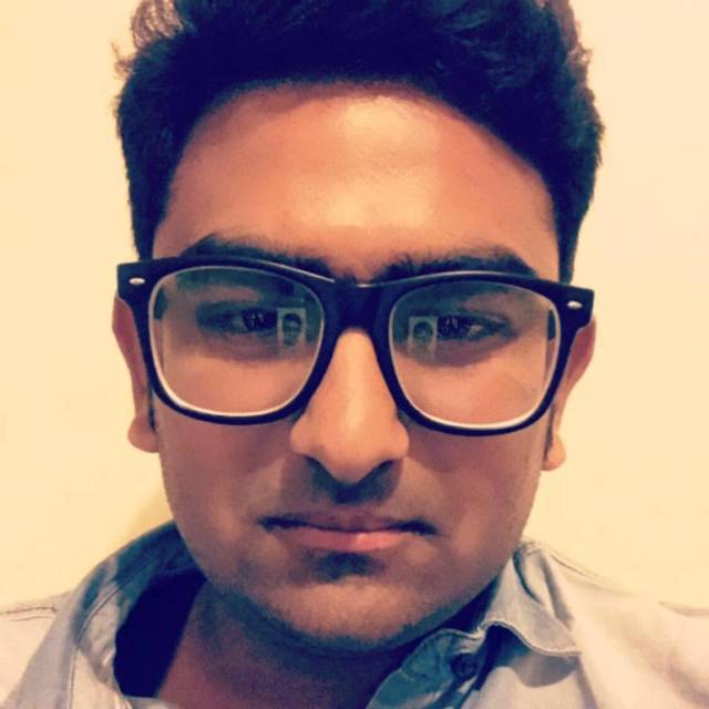 Close-up portrait with black-framed glasses