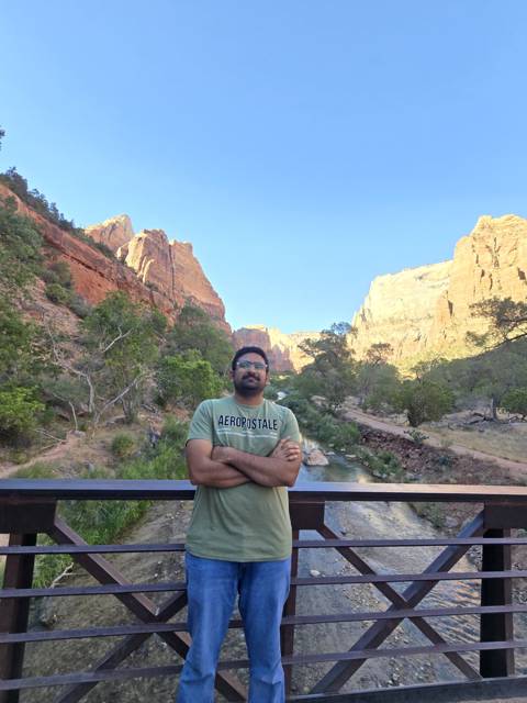 On a bridge in a red rock canyon